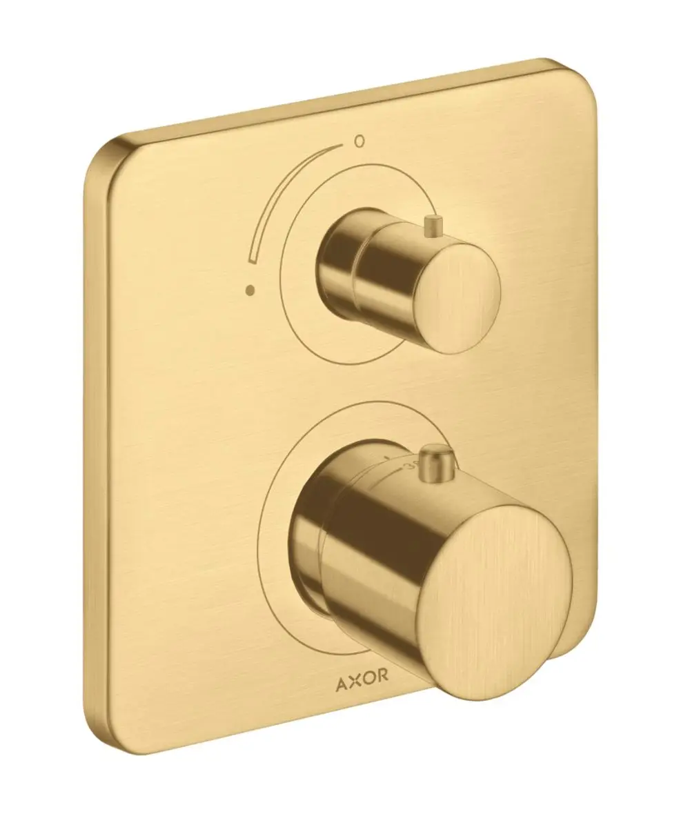 Thermostat-Panel in gebürsteter Goldoptik mit zwei Bedienelementen, hergestellt von AXOR. Die Oberfläche ist matt und hat eine quadratische Form.